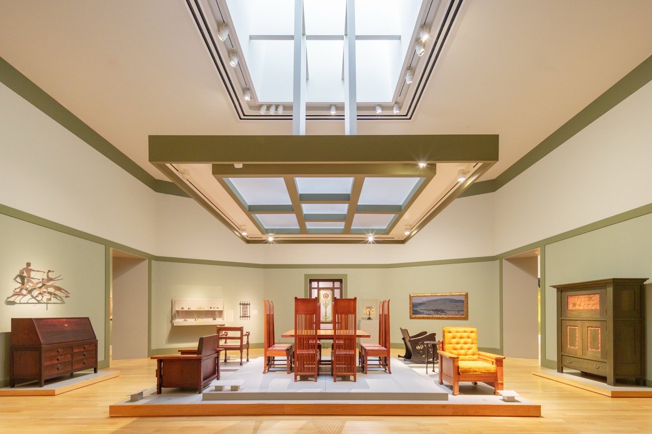 Museum gallery interior lit by layered skylights